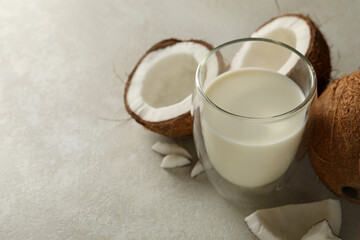 Fresh coconut and coconut milk on white background