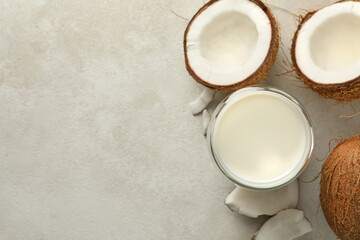 Obraz na płótnie Canvas Fresh coconut and coconut milk on white background