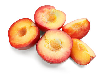 Cut plums isolated on white background