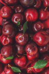 Fresh ripe plums as background
