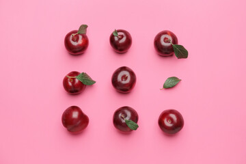 Fresh ripe plums on  color background