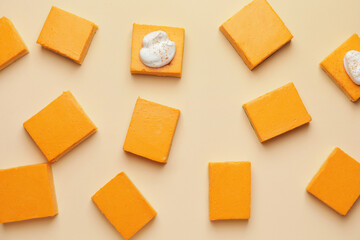 Pieces of tasty pumpkin pie on color background