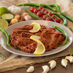 Hot chili pepper tomato sauce pasta with garlic in a bowl close-up. Adjika, spicy harissa sauce - spicy hot chili pepper paste, tomatoes. Spicy ketchup tomato sauce with chili paste