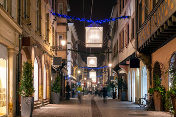 Fototapeta na wymiar Evening street in Strassbourg, France, Christmas decoration and lights
