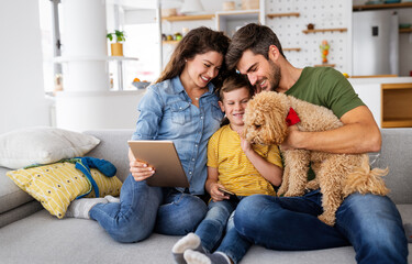 Happy modern family using computer together at home