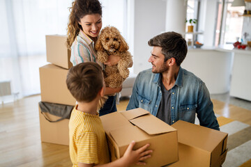 Husband and wife and their son with pet moving in new home.