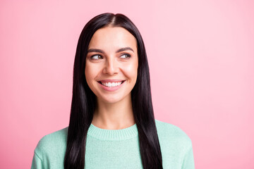 Photo portrait of curious young woman wearing teal sweater looking at copyspace isolated on pastel...