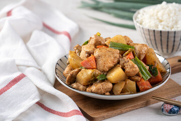 Homemade delicious cubed chicken with braised potato chunks.