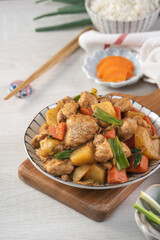 Homemade delicious cubed chicken with braised potato chunks.