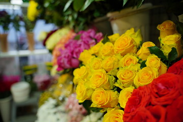 Bouquets of various flowers on counter. Fresh beautiful flowers in florist shop.