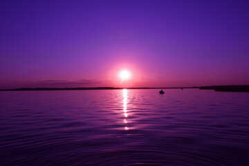 beautiful and sunny sunset on the lake
