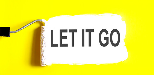 Let it go One open can of paint with white brush on it on yellow background. Top view.