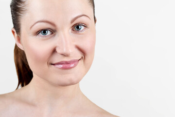 Obraz premium Portrait of pretty smiling woman with nude make up isolated on white background, copy space. Girl with clean healthy skin, beauty model.