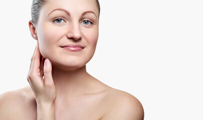 Portrait of pretty smiling woman with nude makeup and hand on chin isolated on white background, copy space. Girl with clean healthy skin, beauty model.