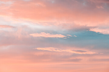 beautiful winter sunrise cloudscape with blue pink and orange colors