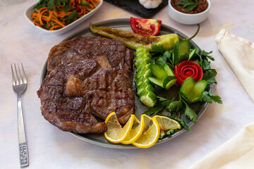 beef steak - cooked ribeye on a white background. grill beef steak. top wiev