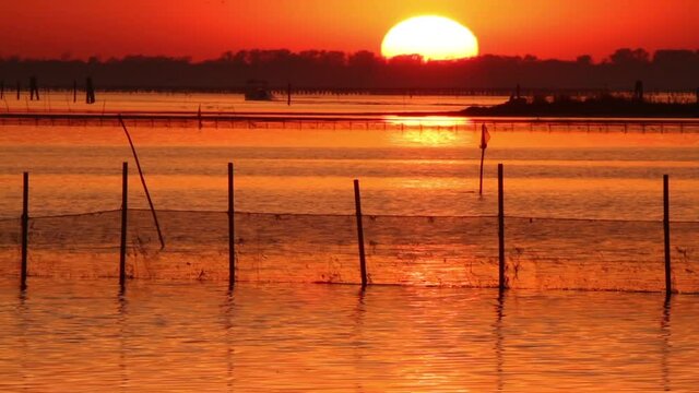 sunset over the po goro delta regional park
