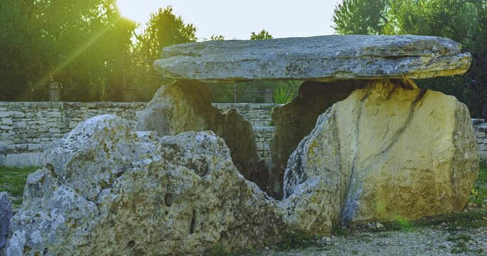 Time lapse sunset of the sun on the Dolmen della Chianca located in the municipality of Bisceglie, Apulia. Italy