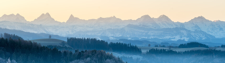 Panorma of the Bernese Alps with Wetterhorn, Schreckhorn, Finsteraarhorn, Eiger, Mönch and Jungfrau on a frosty morning seen from Emmental