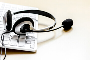 Call center support table with headset and keyboard