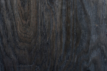 Dark wood texture background. Flat dark surface.