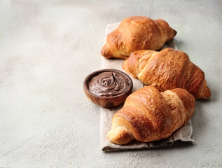 Classic french croissants with chocolate cream. Breakfast