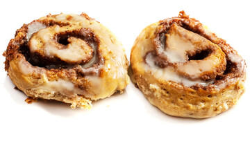 Hand made tasty cinnamon roll on a white plate. Close up. Pastry product.