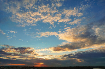 Fototapeta premium Skyline, Beautiful clouds Beautiful sky, Altocumulus clouds, yellow clouds, blue sky, Red light shining through the clouds, abstract background
