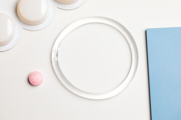 hormone ring and tablets on a white background. Contraceptives