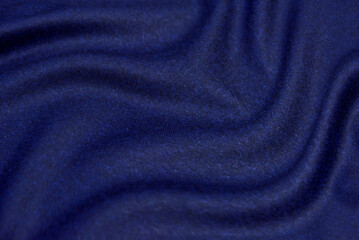 Fototapeta na wymiar Abstract fabric texture of blue jeans, denim or cotton background.