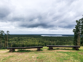 Fototapeta premium Two benches with the lake view