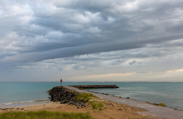 Fototapeta na wymiar Wild weather and storm clouds above the Robe breakwater located in South Australia on November 11th 2020