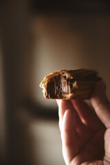 Eclair with chocolate cream, choux pastry