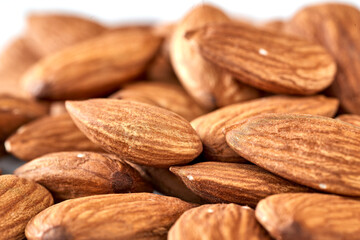 Almonds are the kernel of the nut was lying on a white background.Space for text