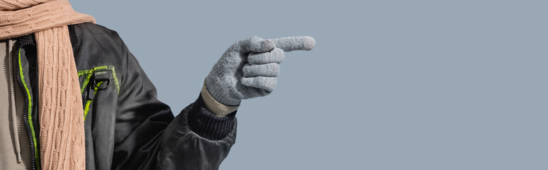 partial view of man in glove pointing with finger isolated on grey, banner