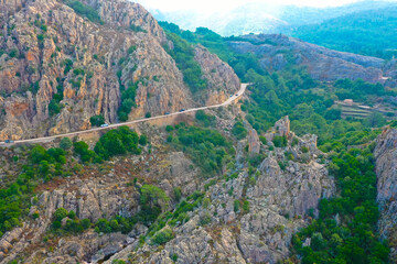 Fototapeta na wymiar Aerial view from the country road D81 road through the Calanches de Piana on the west coast of Corsica, France. Tourism and vacation concept