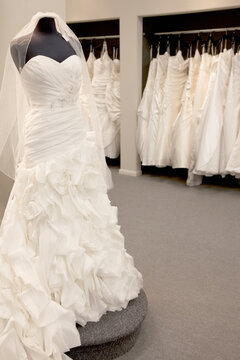 Elegant wedding dress displayed on mannequin in bridal store