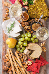 Plate of organic raw vegan cheese, snacks, nuts, fruits