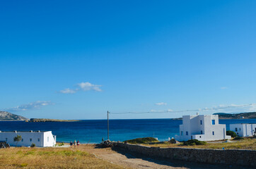 Fototapeta na wymiar White houses in a greek island next to the sea