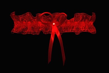 Red lace garter on a black background. - Powered by Adobe