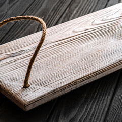 Fototapeta premium A white wood tray for tea and coffee stands on a wood table
