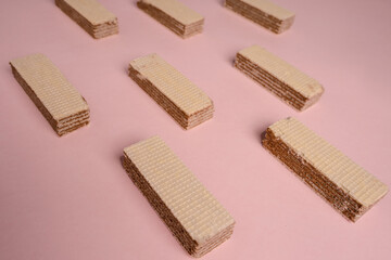 Waffle pattern on a pink background, waffles are in a row