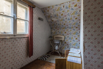 room with old washbasin in a abandoned house