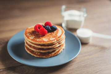 Collagen powder recipes concept. Pancakes made with collagen or protein  powder. Perfect tasty and healthy breakfast. Beauty supplements for skin and bones.