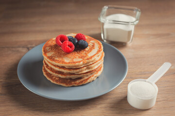 Collagen powder recipes concept. Pancakes made with collagen or protein  powder. Perfect tasty and healthy breakfast. Beauty supplements for skin and bones.