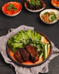Asian cuisine. Ribs on the grill with vegetables.Traditional Chinese and Korean cuisine