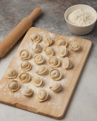 Prepared semi-finished products. Dumplings, khinkali, manti. New year's atmosphere