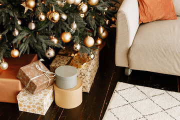 Beautiful  boxes with gifts under the Christmas tree. New year and Christmas holidays concept.