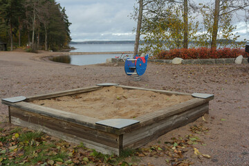 Sandbox on the playground by the lake