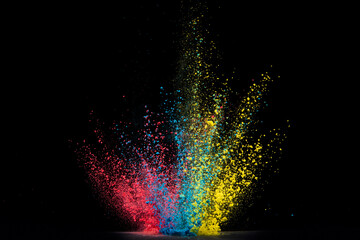 Explosion of colour powder isolated on black background. Abstract colour background